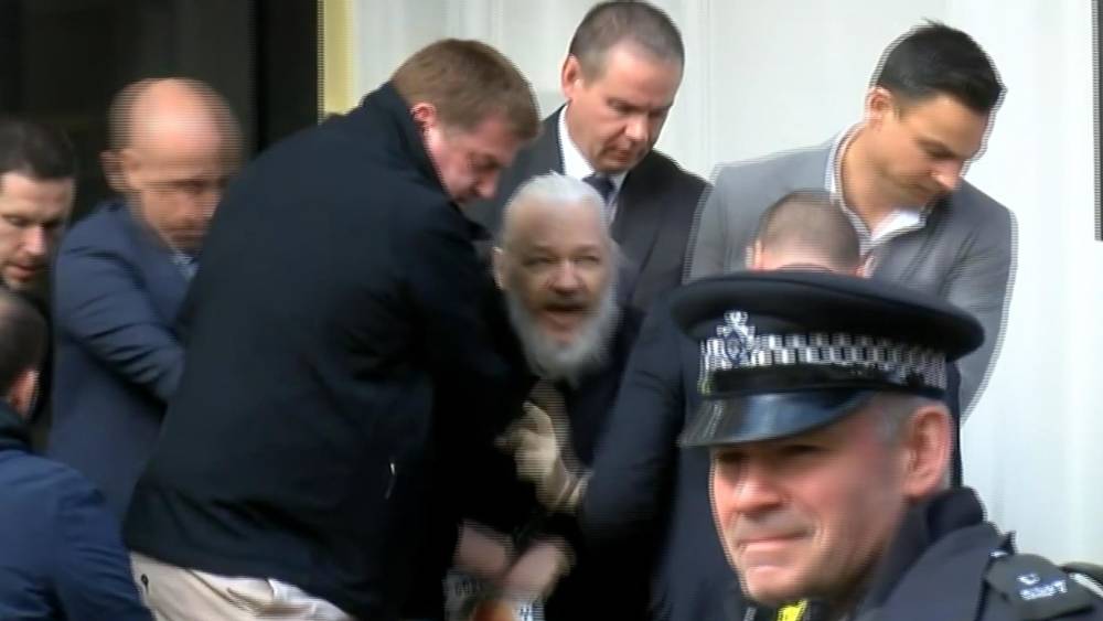 IMG JULIAN ASSANGE of Wikileaks being Arrested